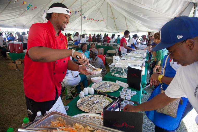 Chef Taj serves dished at Afternoon on the Green