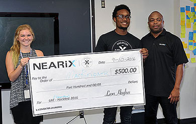 Mackenzie Gross and Amali Krigger accept 2016 HackFest Best Hack award from NEARiX CEO and Founder Leon Hughes. 