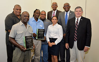 UVi Physical Plant employees accept the Presidential Appreciation Award.