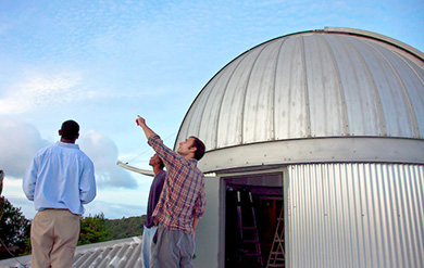 UVI observatory with students pointing to the sky