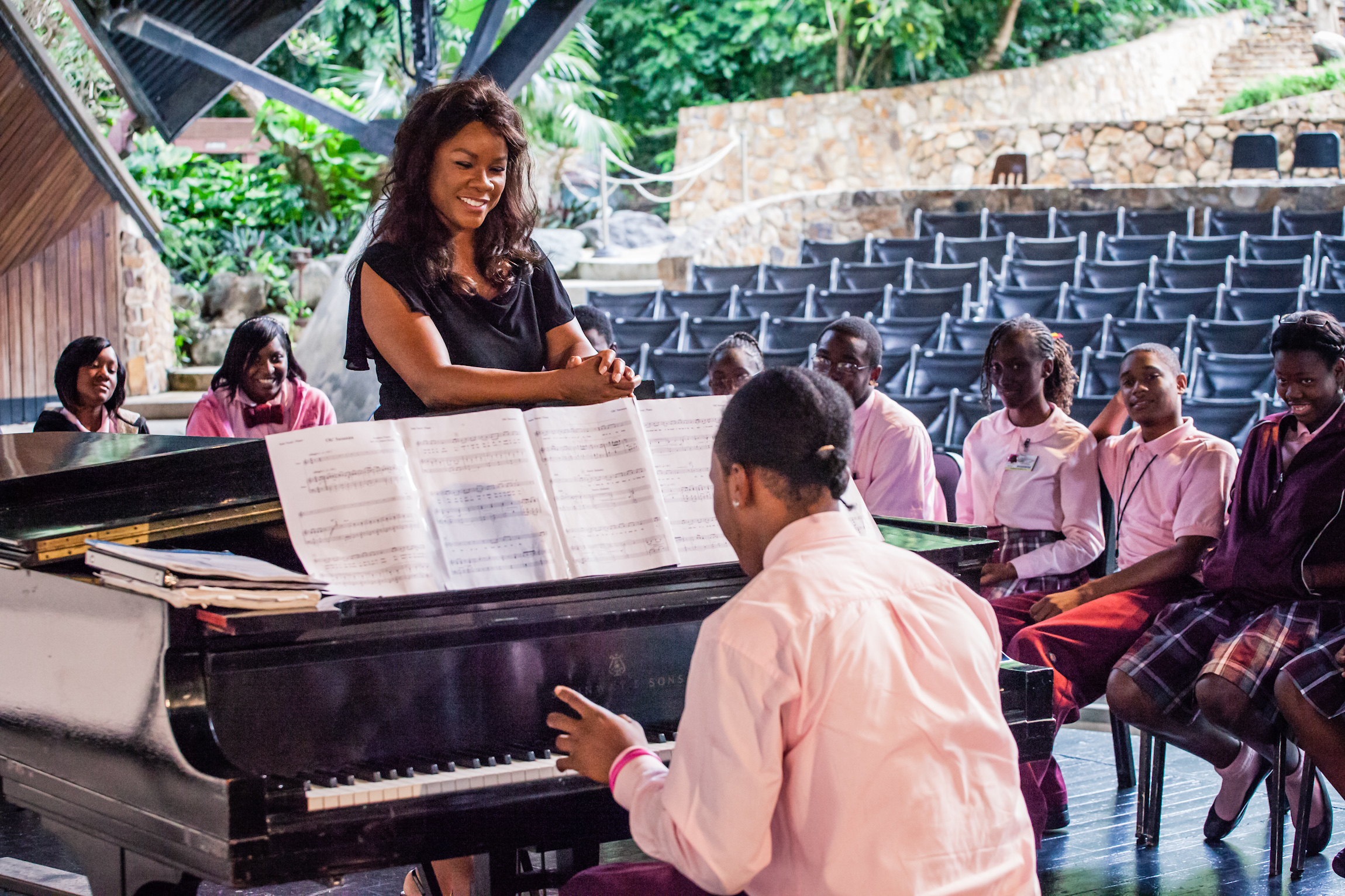 Denyce Graves on stage with students