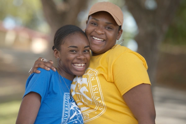 Two students smiling